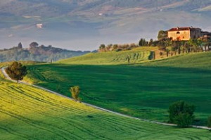 a dirt road leads to this villa near the village of Pienza in Val d'Orcia (a World Heritage Site); Tuscany, Italy.