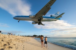 Sint Maarten a plane flies low over Maho Beach into the airport.