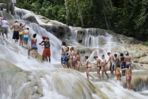 Escorted groups climb the Dunn's River Falls in Jamaica.