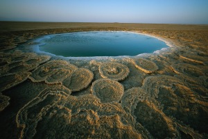 Discs of travertine ring a twelve-foot wide hot spring in the Danakil Depression, Ethiopia.