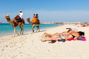 Tourists on a beach in Dubai. Dress codes are more relaxed in many Middle Eastern countries than you might think.