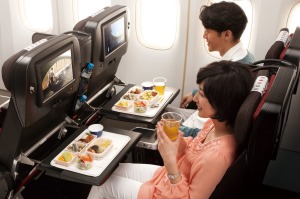 Passengers enjoy economy seating on Japan Airlines.