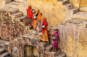 Women gathering water from a stepwell in Amer, near Jaipur,