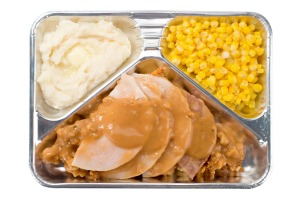 A microwave TV dinner can offer you all the joys of dining on a plane in the comfort of your own home.