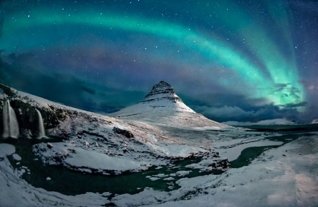 'Under Aurora Bridge': Yevhen Samuchenko

"Aurora borealis with an unusual arc shape above Kirkjufell
mountain in Iceland."