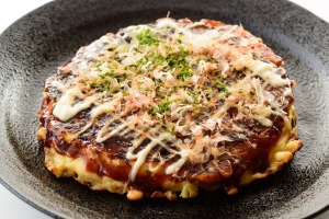 Okonomiyaki is a delicious mess of a thing.