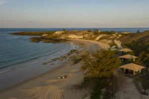 Banubanu Beach Retreat sits on a crescent-shaped white sand beach, lined with safari tents.