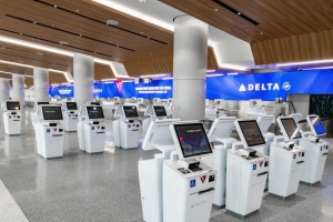 T2 and T3 share an airy new Delta check-in/bag drop area with 32 self-serve booths and 46 check in positions.