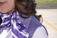 The uniform includes a purple scarf that can be worn as a hair, neck or pocket accessory.