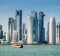 Traditional Dhow cruising in Doha Bay towards the modern Doha Skyscraper Skyline. Doha, Qatar, Middle East iStock image ...