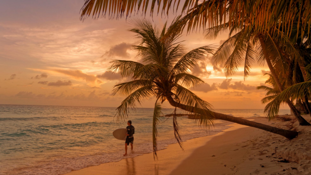 HDXGGN Surfer and Sunset at Dover Beach, St. Lawrence Gap, South Coast, Barbados, Caribbean. 
SatJan26Cover