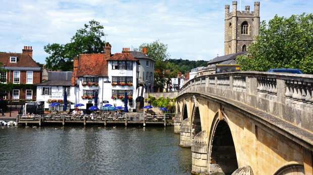 Henley-On-Thames, United Kingdom - July 10, 2015: View across the River Thames towards The Angel Pub with people enjoying the sunshine, Henley-on-Thames, Oxfordshire, England, UK, Western Europe. SunSept29Ten - Traveller Ten - 10 of the best British TV locations - text Steve McKenna
iStock image for Traveller. Re-use permitted.