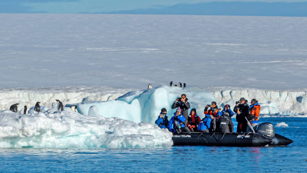 
SatNov27Cover
Passengers from the luxurious Scenic Eclipse cruise ship on an off-ship excursion observe penguins in Antarctica.
Photos: supplied